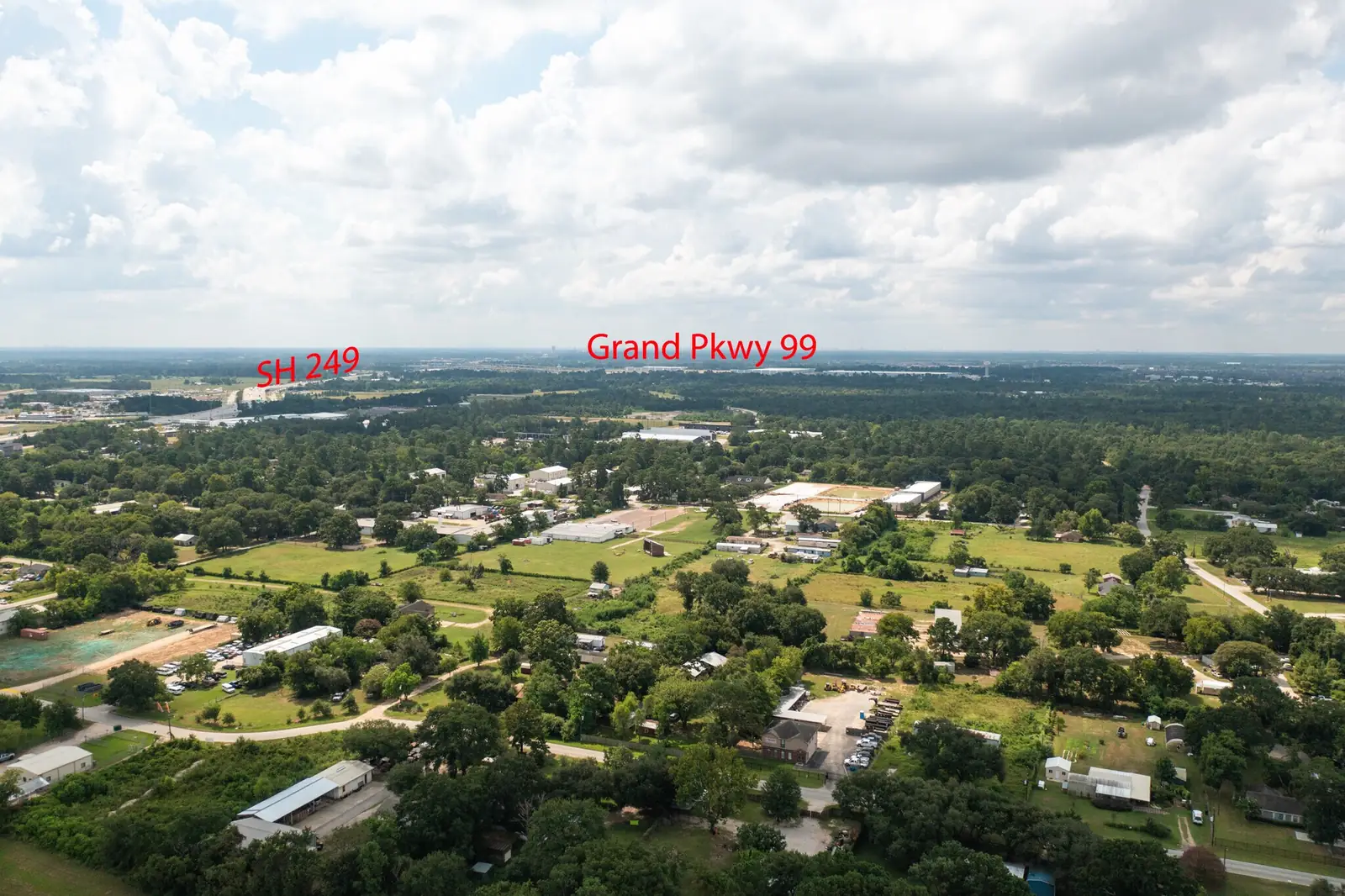 Aerial context view showing the site's position relative to SH 249 and the Grand Parkway (99)